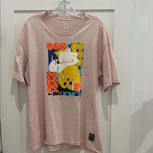 Nike Pastel Pink Tee with Vibrant Graphic in good condition. Mens size small